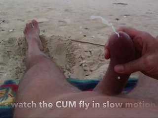 Curved cock wank and cum at nude beach